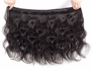 Cheveux 100% onduleux brésiliens de Vierge les longs empaquettent trois parties x la fermeture 4